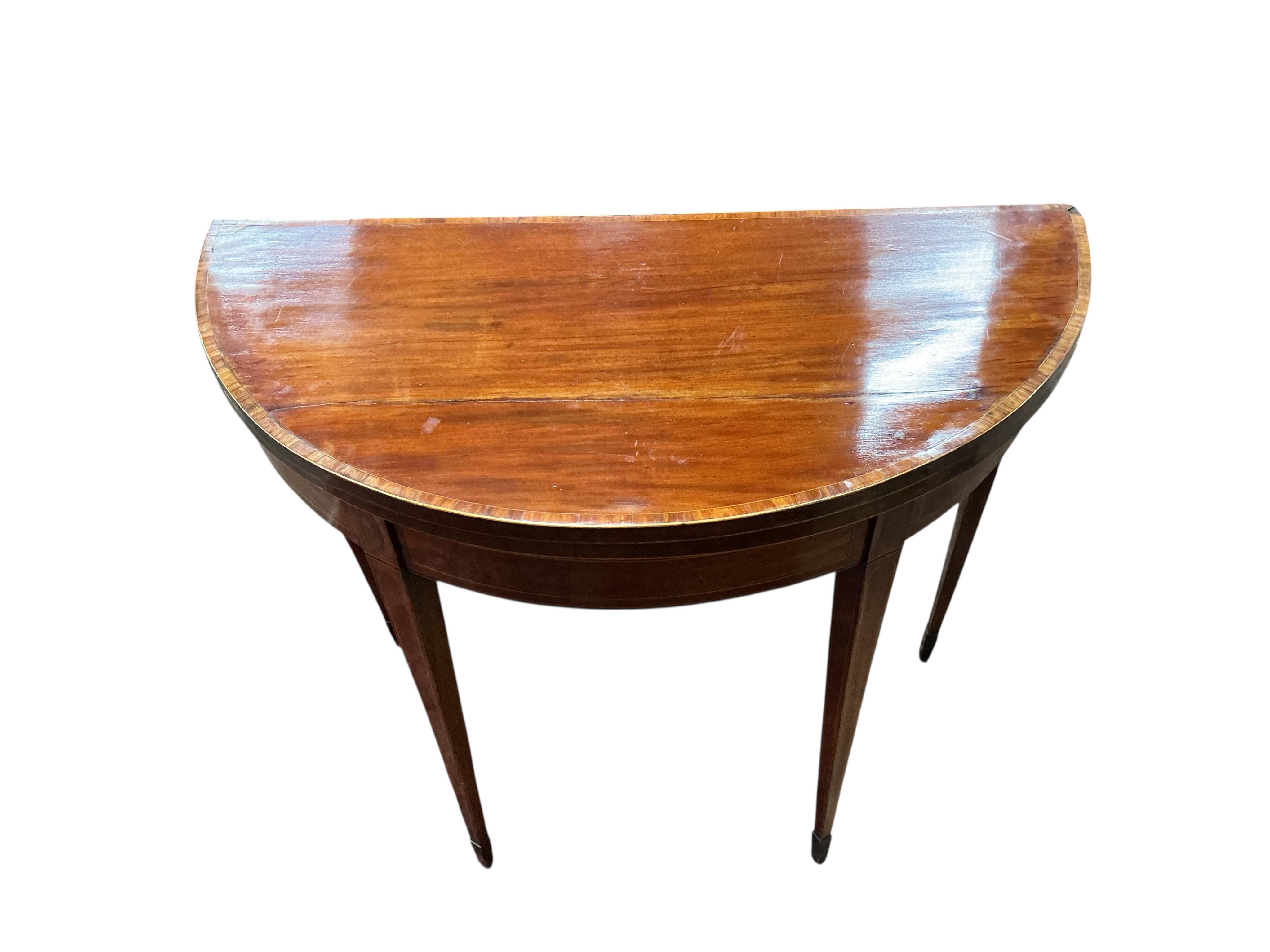A George III tulip banded mahogany demi-lune folding card table, width 91cm, depth 45cm, height 74cm